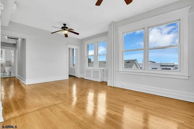 a view of an empty room with a window
