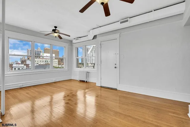 a view of an empty room with a window