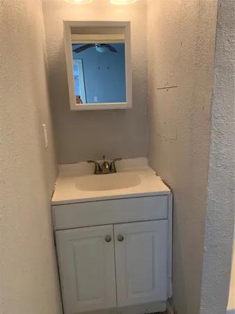 a bathroom with a sink and mirror