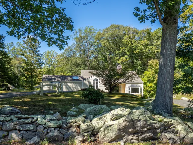 a backyard of a house with lots of green space