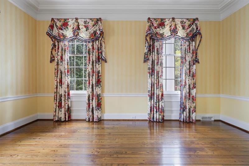 3700 Randall Mill Road Northwest Atlanta, GA 30327 - Photo 11 of 59 an empty room with wooden floor and windows