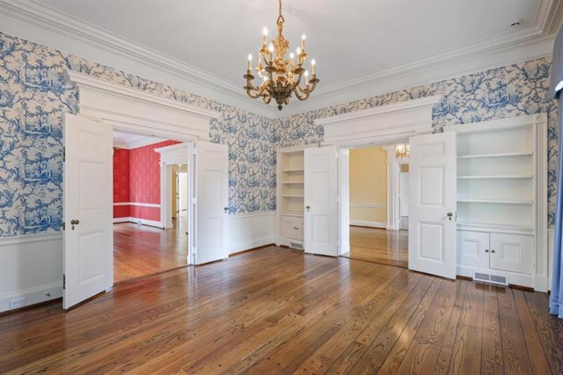 3700 Randall Mill Road Northwest Atlanta, GA 30327 - Photo 16 of 59 a view of an empty room with a window and wooden floor