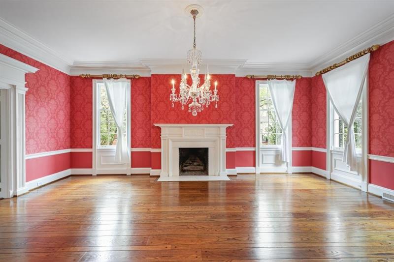 3700 Randall Mill Road Northwest Atlanta, GA 30327 - Photo 17 of 59 a view of empty room with wooden floor and fireplace