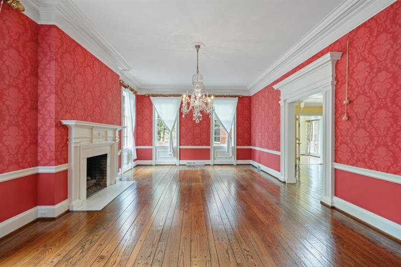3700 Randall Mill Road Northwest Atlanta, GA 30327 - Photo 18 of 59 a view of an empty room with wooden floor fireplace and a window