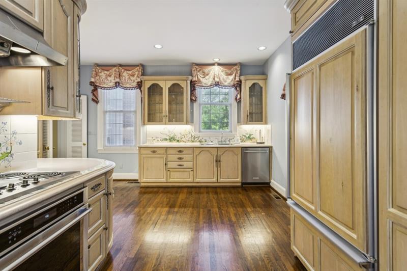 3700 Randall Mill Road Northwest Atlanta, GA 30327 - Photo 25 of 59 a kitchen with stainless steel appliances granite countertop a stove and a refrigerator