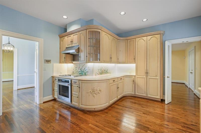 3700 Randall Mill Road Northwest Atlanta, GA 30327 - Photo 28 of 59 a kitchen with stainless steel appliances granite countertop a sink a stove and a wooden floors