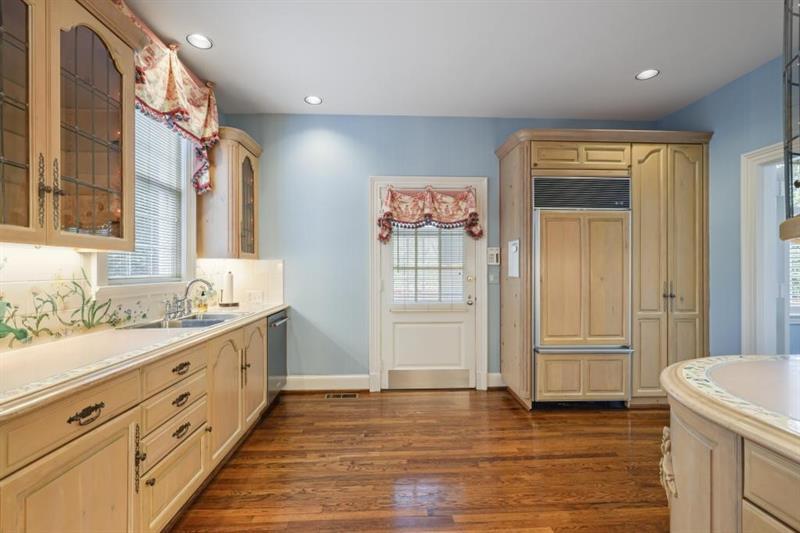 3700 Randall Mill Road Northwest Atlanta, GA 30327 - Photo 29 of 59 a bathroom with a granite countertop sink and a mirror