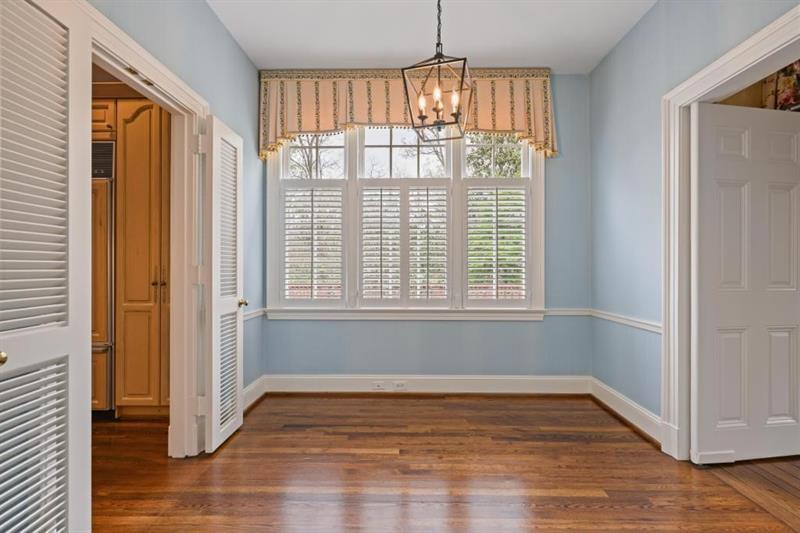 3700 Randall Mill Road Northwest Atlanta, GA 30327 - Photo 30 of 59 a view of empty room with wooden floor and fan