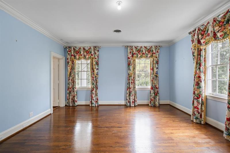 3700 Randall Mill Road Northwest Atlanta, GA 30327 - Photo 33 of 59 an empty room with wooden floor and windows
