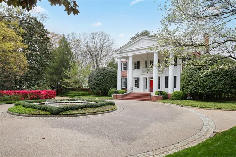 3700 Randall Mill Road Northwest Atlanta, GA 30327 - Photo 59 of 59 a front view of a house with a yard and garage