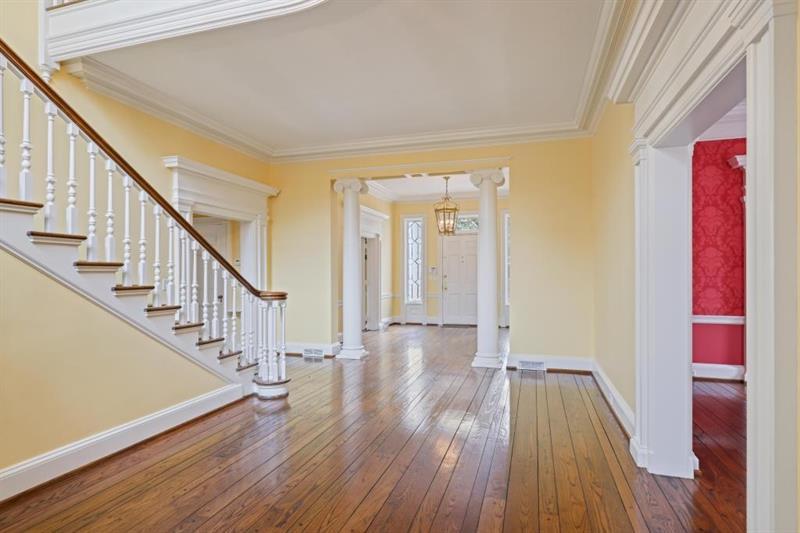 3700 Randall Mill Road Northwest Atlanta, GA 30327 - Photo 9 of 59 a view of a hallway with wooden floor and staircase