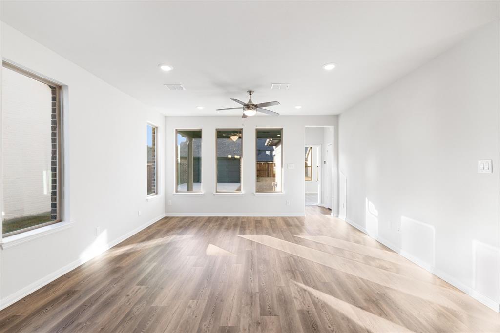 1840 Rosedale Avenue Van Alstyne, TX 75495 - Photo 9 of 26 wooden floor in an empty room with a window