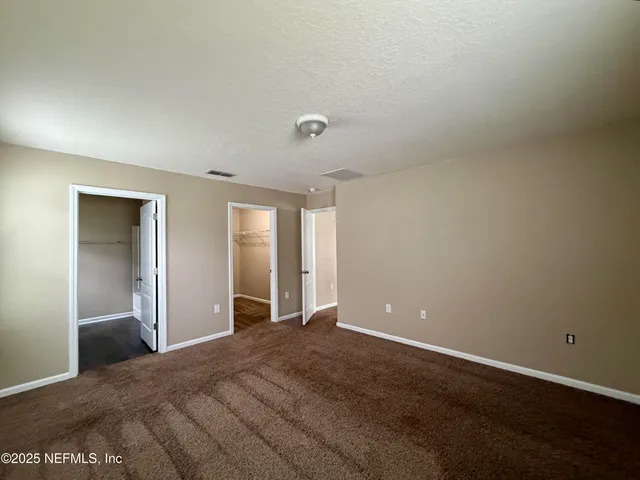 a kitchen with granite countertop a sink stove and refrigerator