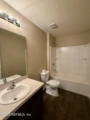 a bathroom with a sink and a bathtub