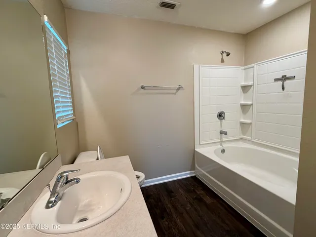 a kitchen with stainless steel appliances granite countertop a refrigerator and a stove