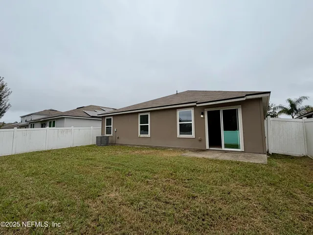 a bathroom with a double vanity sink toilet and mirror