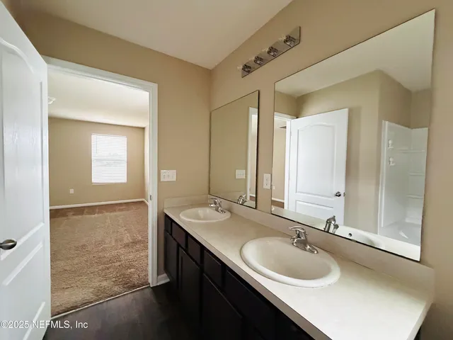 a bathroom with a bathtub and a shower