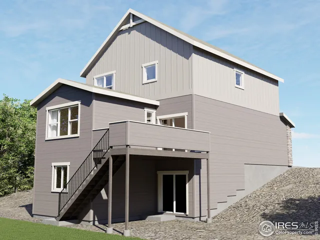 a view of house that has tree in front of it