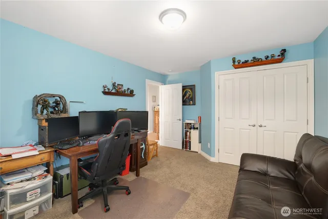 a bed room with a bed and a couch