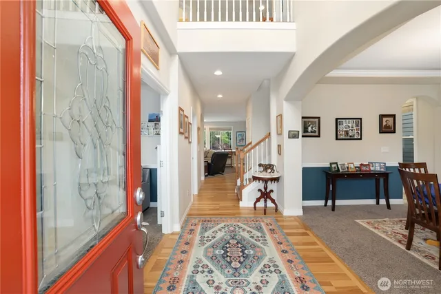 a living room with furniture a dining table and a piano