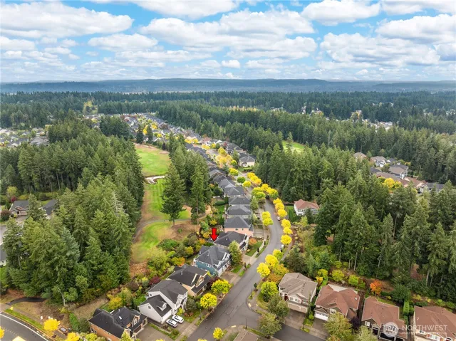 a view of a lake with a flower garden