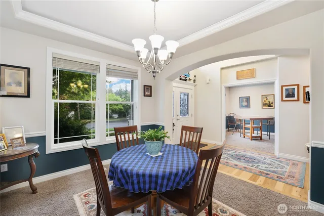 a view of a dining room with furniture window and outside view
