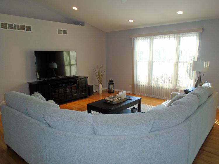 136 Lake Lida Lane Rochelle, IL 61068 - Photo 6 of 19 a living room with furniture and a flat screen tv