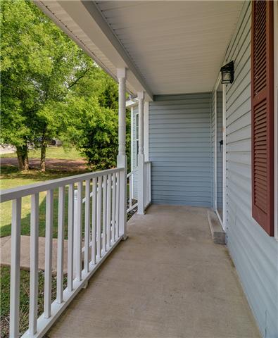 3121 Country Way Road Antioch, TN 37013 - Photo 3 of 20 Plenty of room on this front covered porch --- just waiting for those new white rocking chairs OR cute bistro set, with plants & hanging baskets! NOTE: The front door and shutters have been recently painted white to match the garage!!!