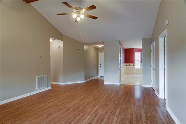 3121 Country Way Road Antioch, TN 37013 - Photo 10 of 20 Ah! Welcome inside this gorgeous 21x15 living room w/ vaulted ceilings, center beam, & new hardwoods! This room is the center of the home - and offers a friendly inviting entrance & flows nicely through-out in several directions!