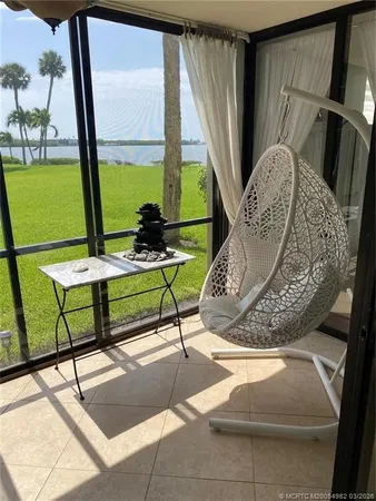 a living room with a window and furniture