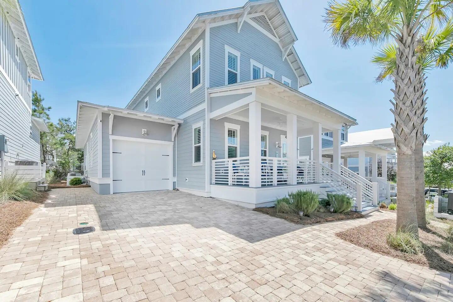 a view of a house with a yard and plants