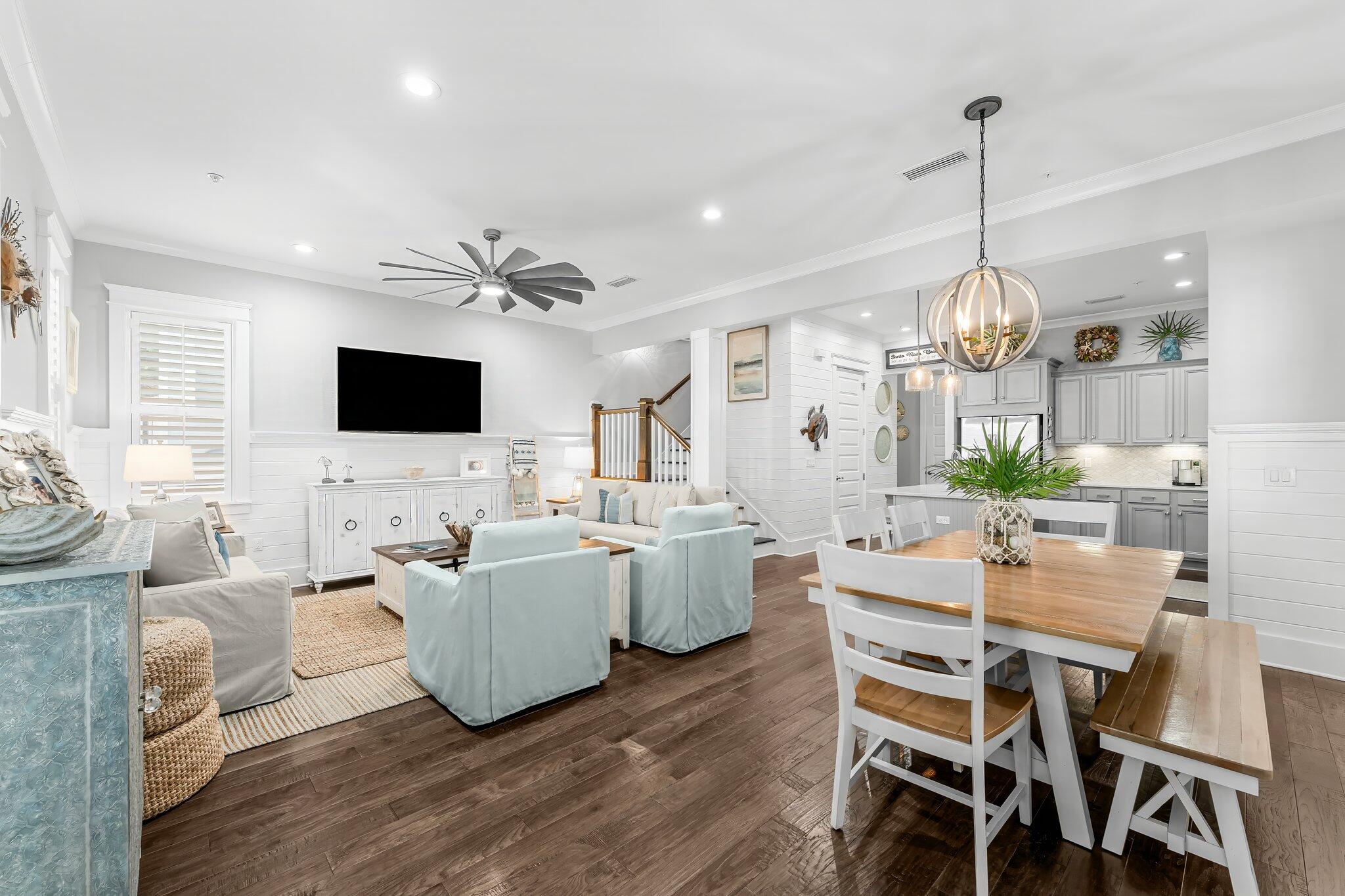 116 Gulfview Way Santa Rosa Beach, FL 32459 - Photo 11 of 59 a view of a dining room with furniture a chandelier and wooden floor