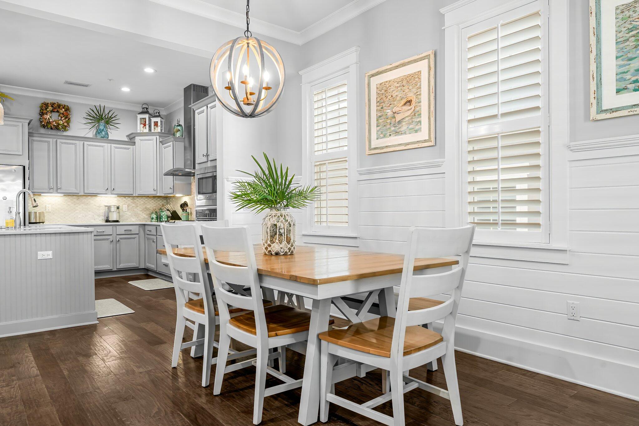116 Gulfview Way Santa Rosa Beach, FL 32459 - Photo 14 of 59 a dining room with furniture a chandelier and wooden floor