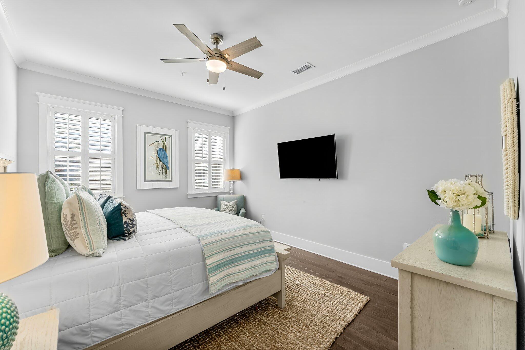 116 Gulfview Way Santa Rosa Beach, FL 32459 - Photo 20 of 59 a bedroom with a bed mirror on dresser and a window