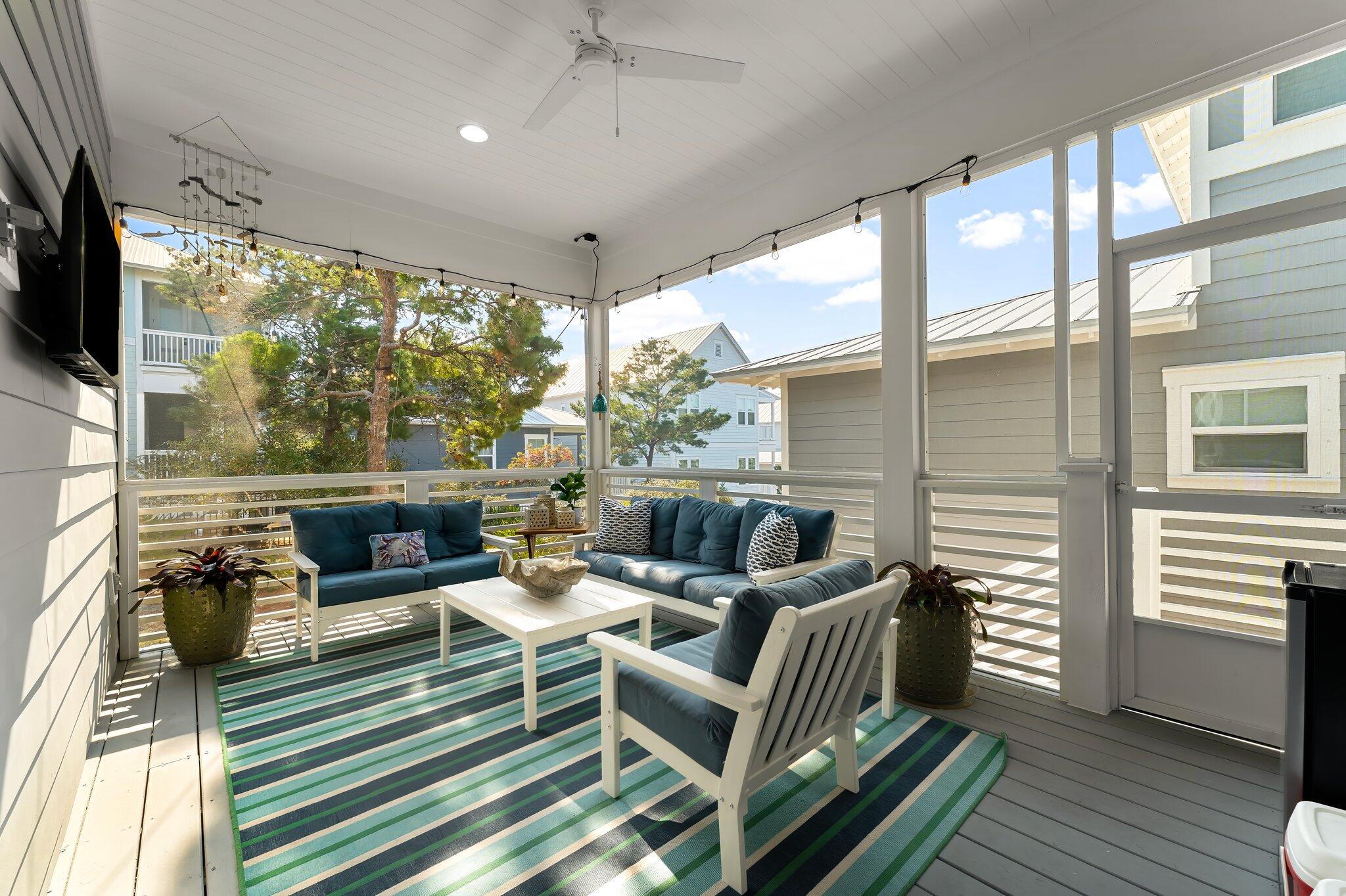 116 Gulfview Way Santa Rosa Beach, FL 32459 - Photo 4 of 59 a living room with patio furniture and a flat screen tv