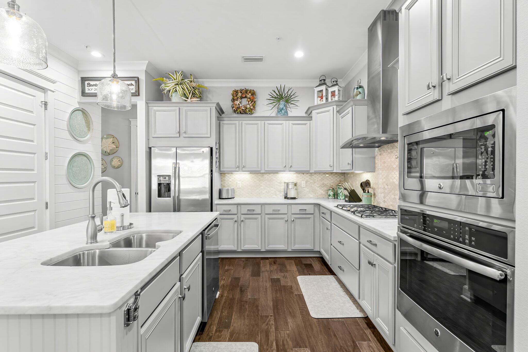 116 Gulfview Way Santa Rosa Beach, FL 32459 - Photo 6 of 59 a kitchen with stainless steel appliances granite countertop a sink and cabinets