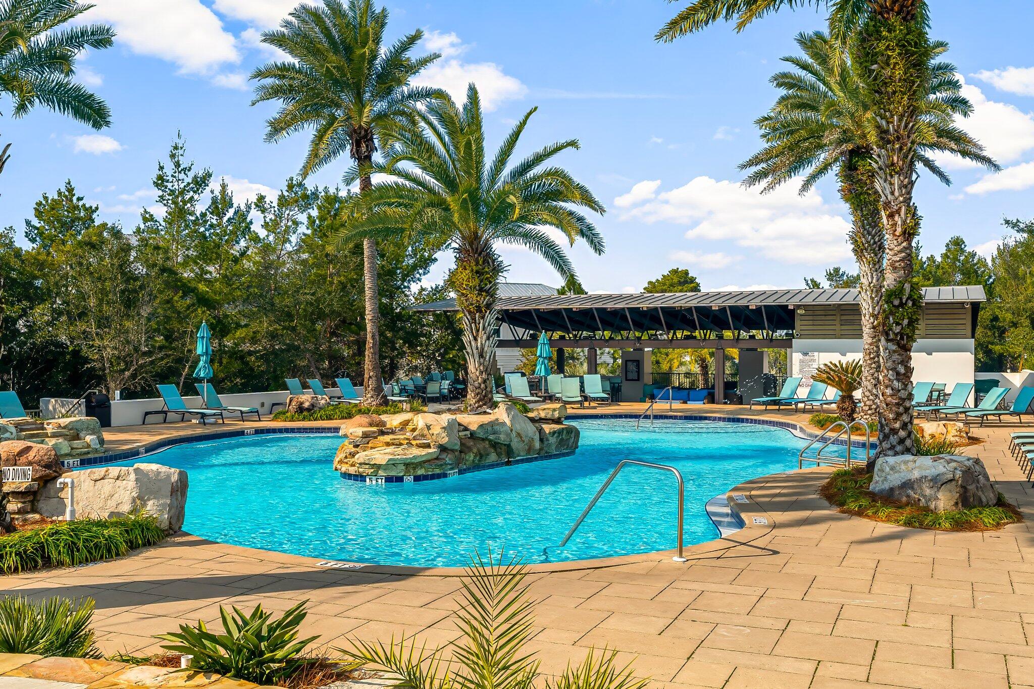 116 Gulfview Way Santa Rosa Beach, FL 32459 - Photo 10 of 59 a view of a swimming pool with a patio and a garden