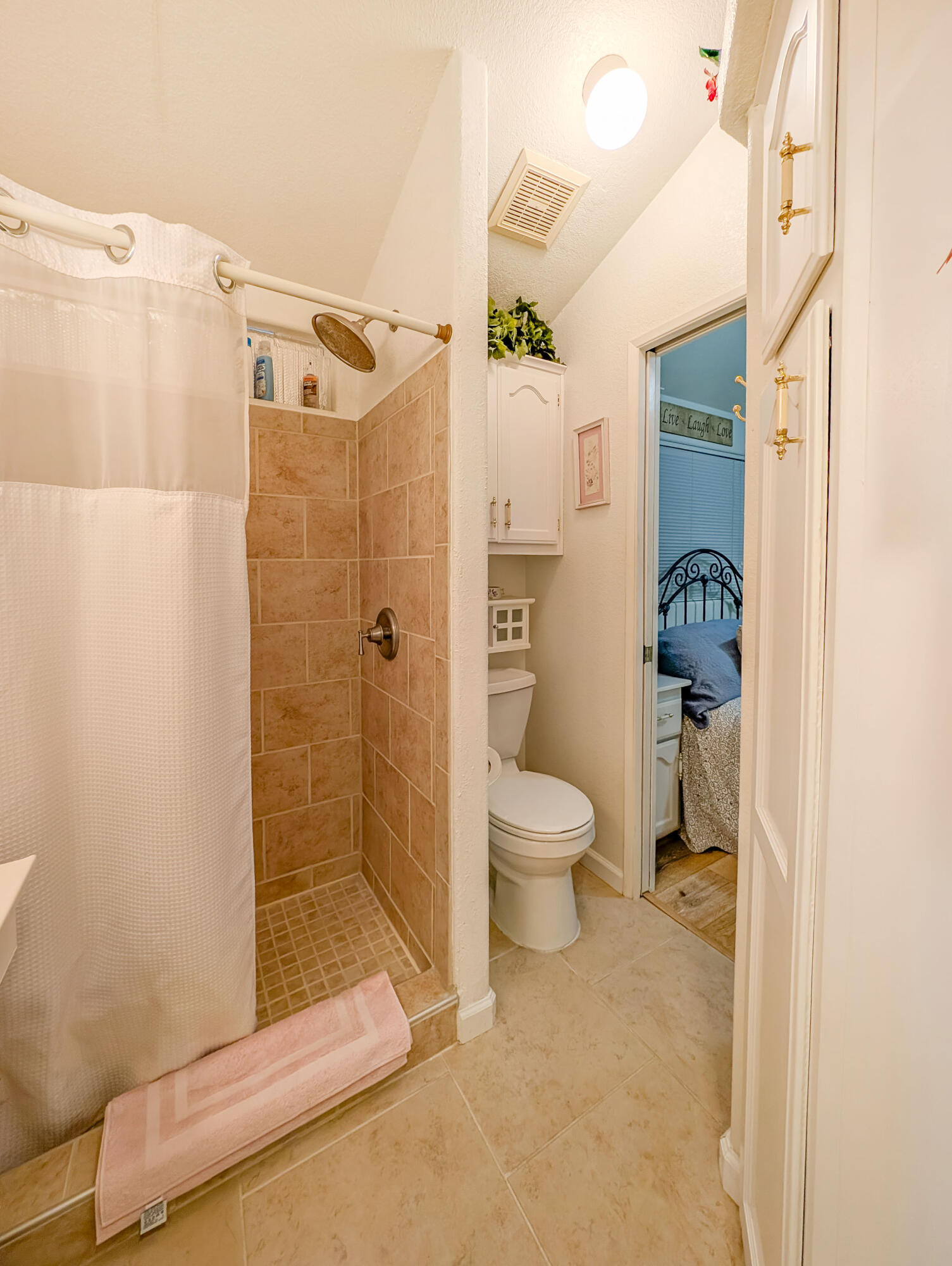 70200 Dillon Road, Unit 493 Desert Hot Springs, CA 92241 - Photo 25 of 35 a bathroom with a shower and a toilet