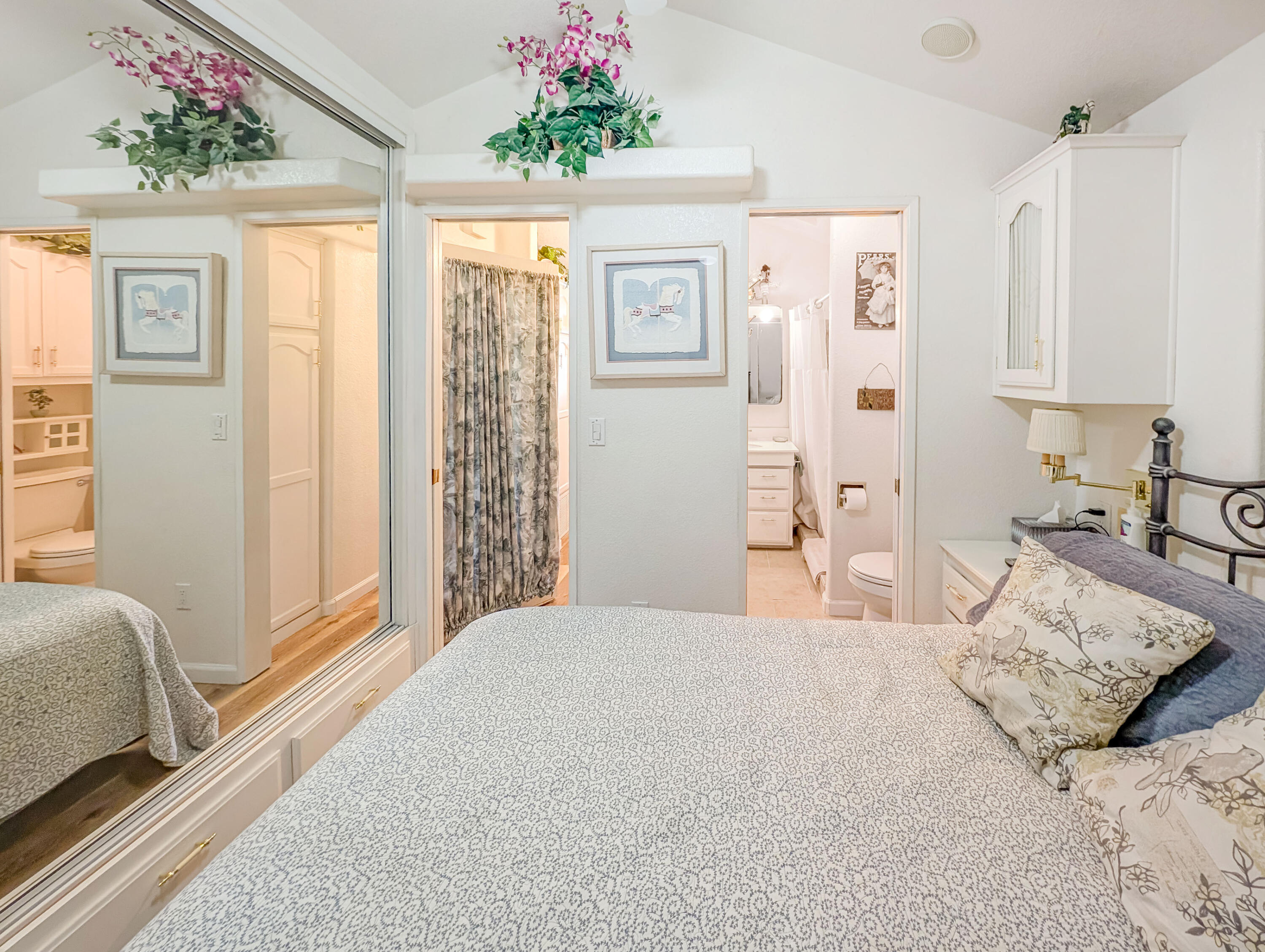 70200 Dillon Road, Unit 493 Desert Hot Springs, CA 92241 - Photo 30 of 35 a bedroom with a large bed and a window