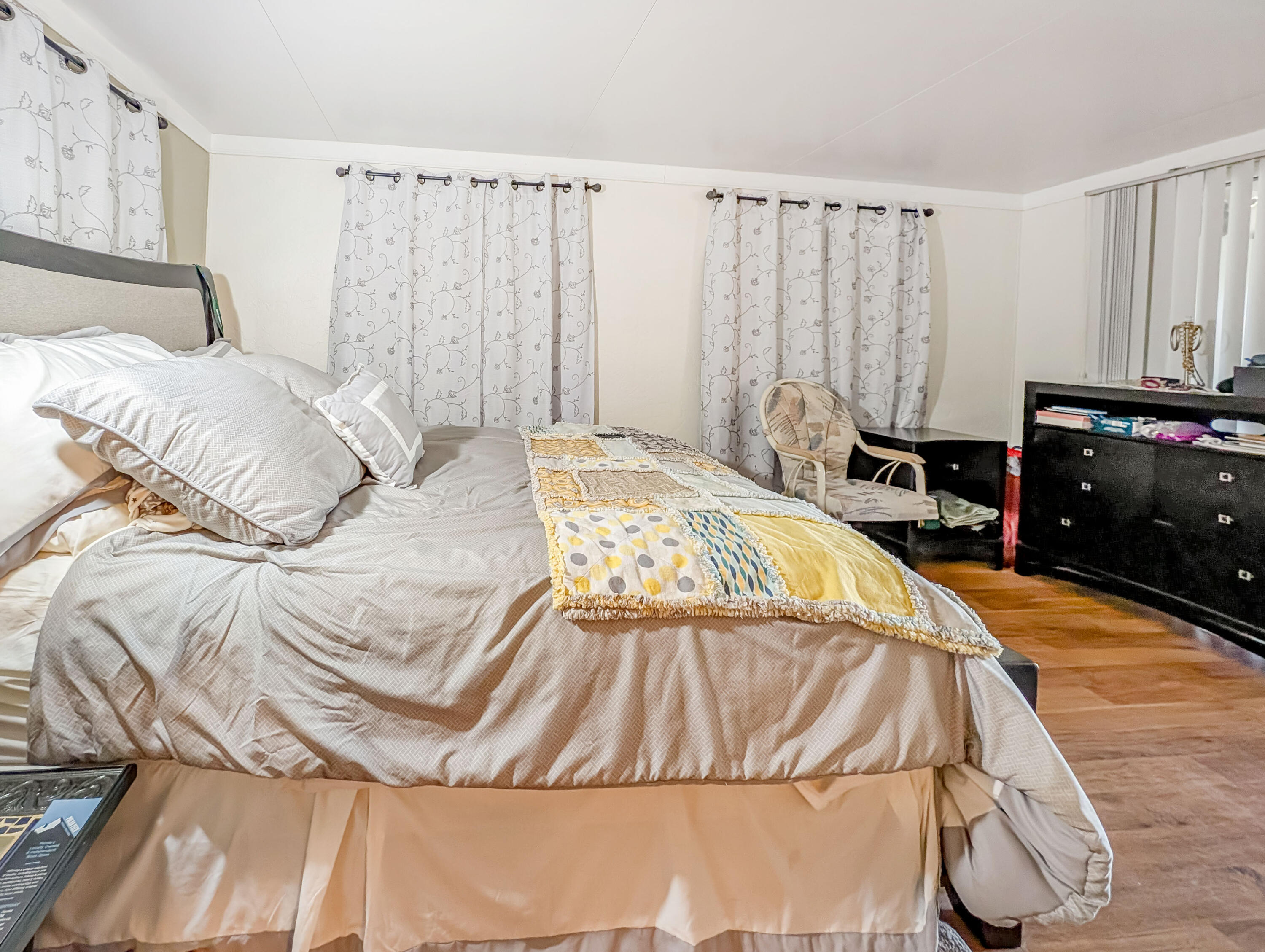 70200 Dillon Road, Unit 493 Desert Hot Springs, CA 92241 - Photo 31 of 35 a bedroom with a bed and a dresser