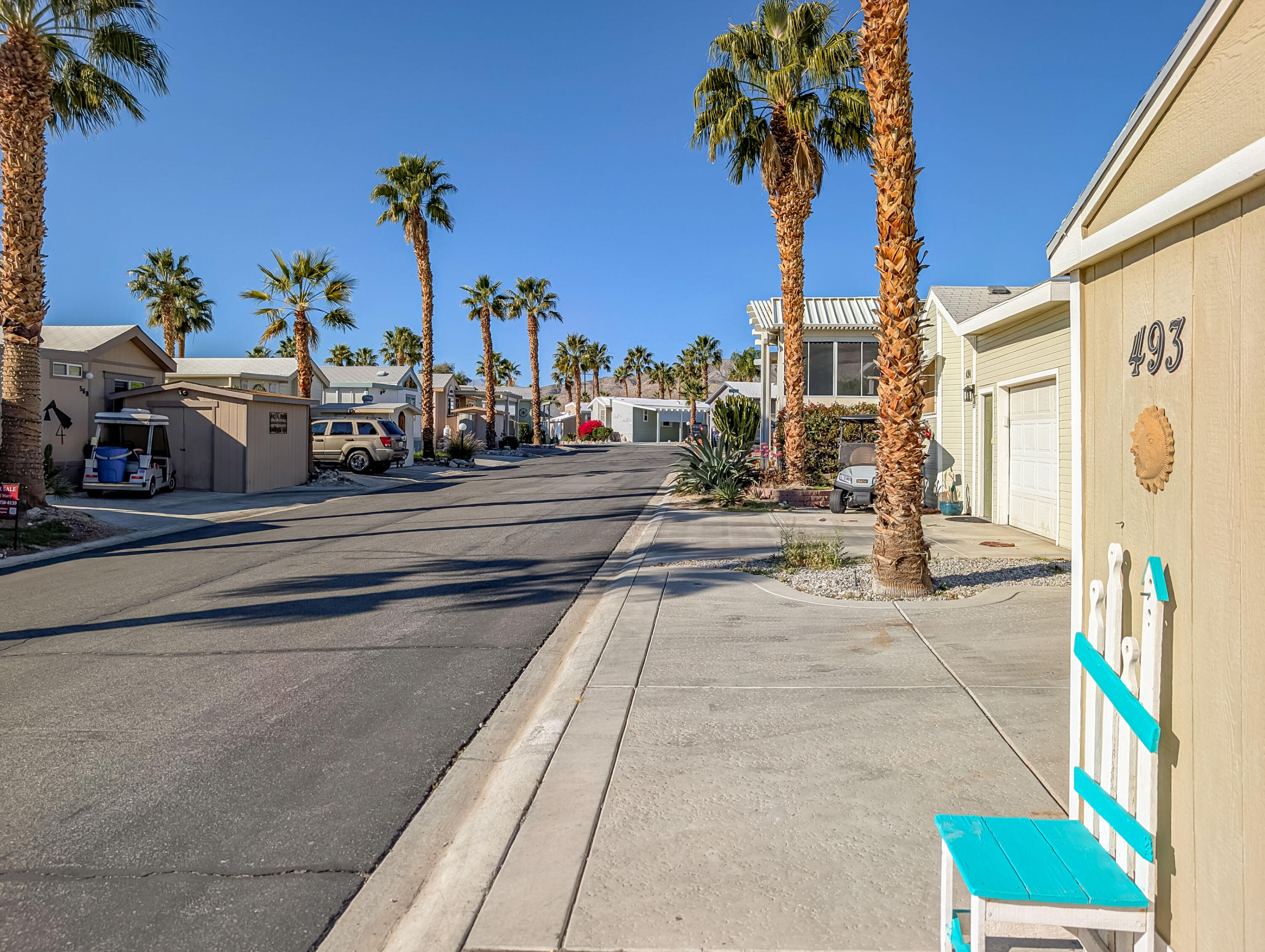 70200 Dillon Road, Unit 493 Desert Hot Springs, CA 92241 - Photo 4 of 35 a view of a street with cars