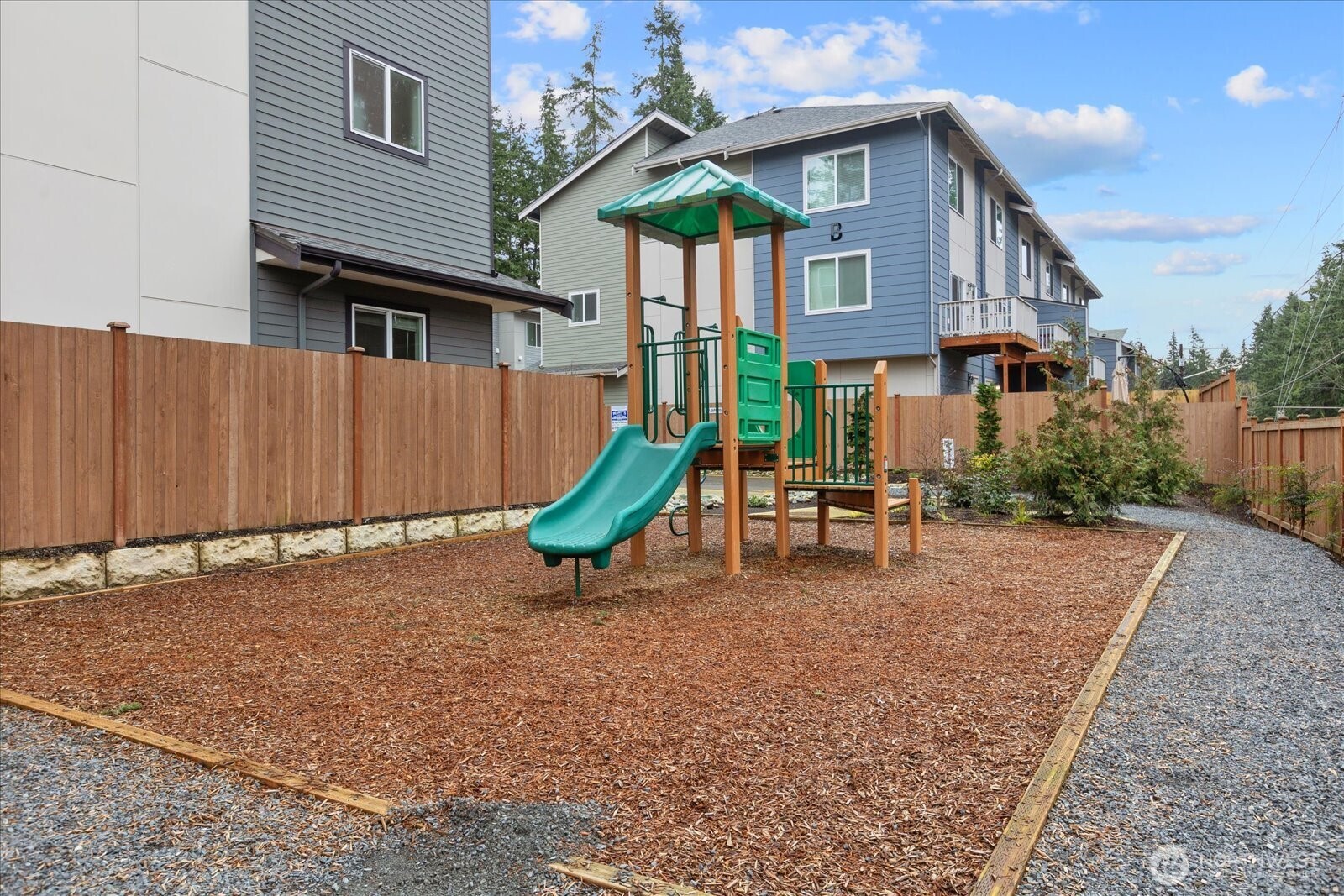 23413 Edmonds Way, Unit A2 Edmonds, WA 98026 - Photo 36 of 40 a view of a house with backyard and a tree