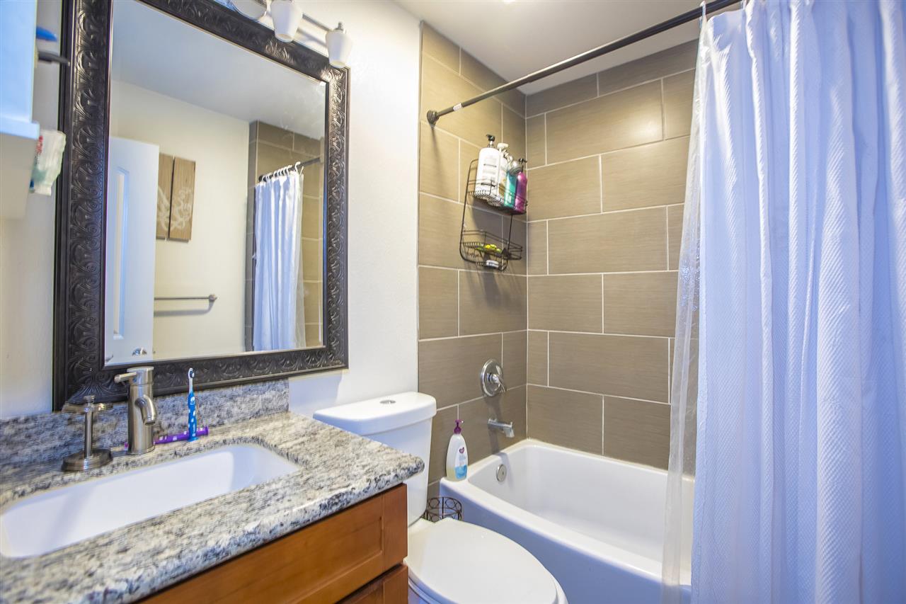 98 East Welakahao Road Kihei, HI 96753 - Photo 11 of 26 a bathroom with a granite countertop sink toilet and shower