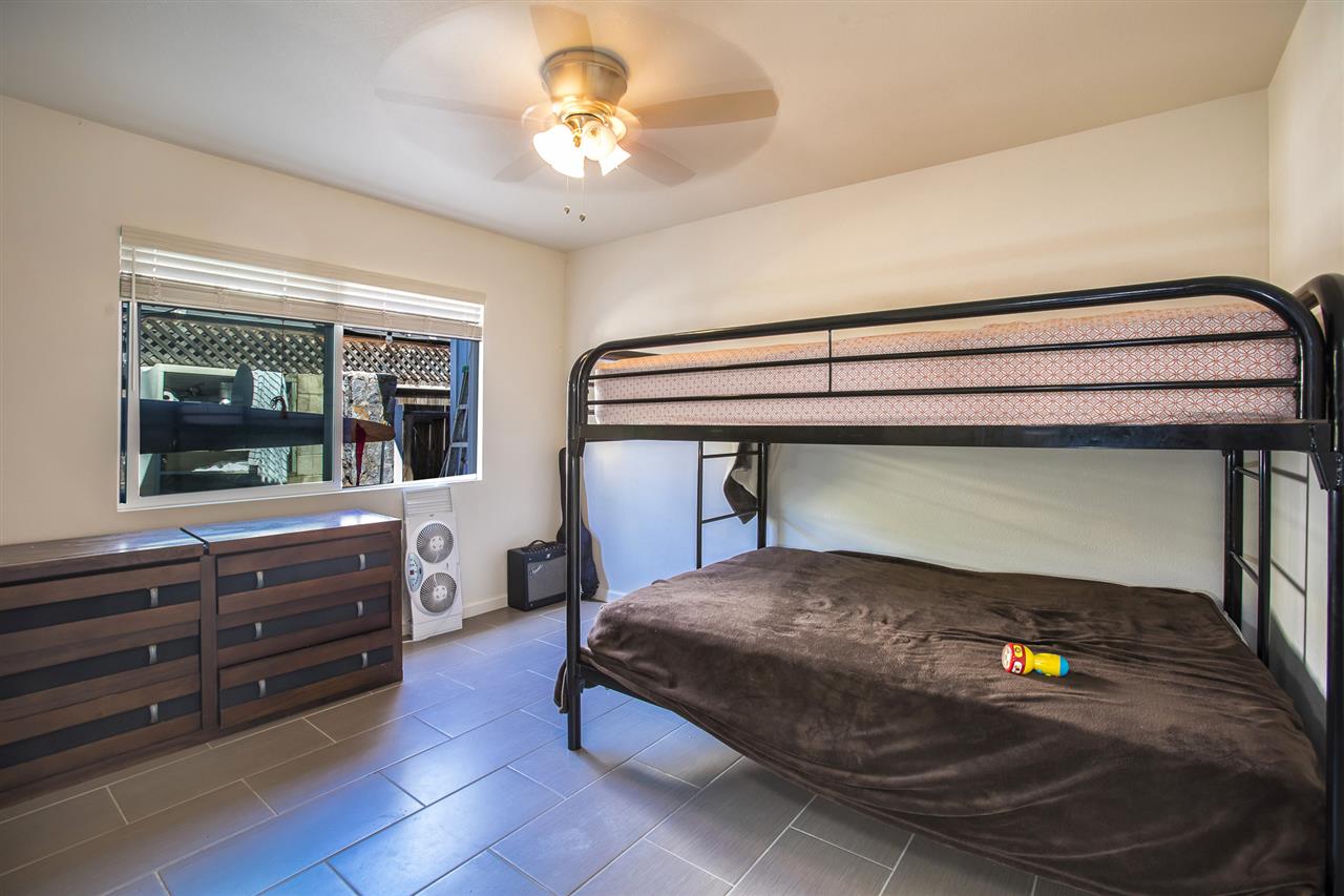 98 East Welakahao Road Kihei, HI 96753 - Photo 12 of 26 a bedroom with a bed and a window