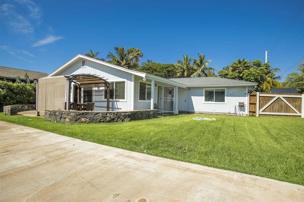 98 East Welakahao Road Kihei, HI 96753 - Photo 2 of 26 a front view of a house with a yard