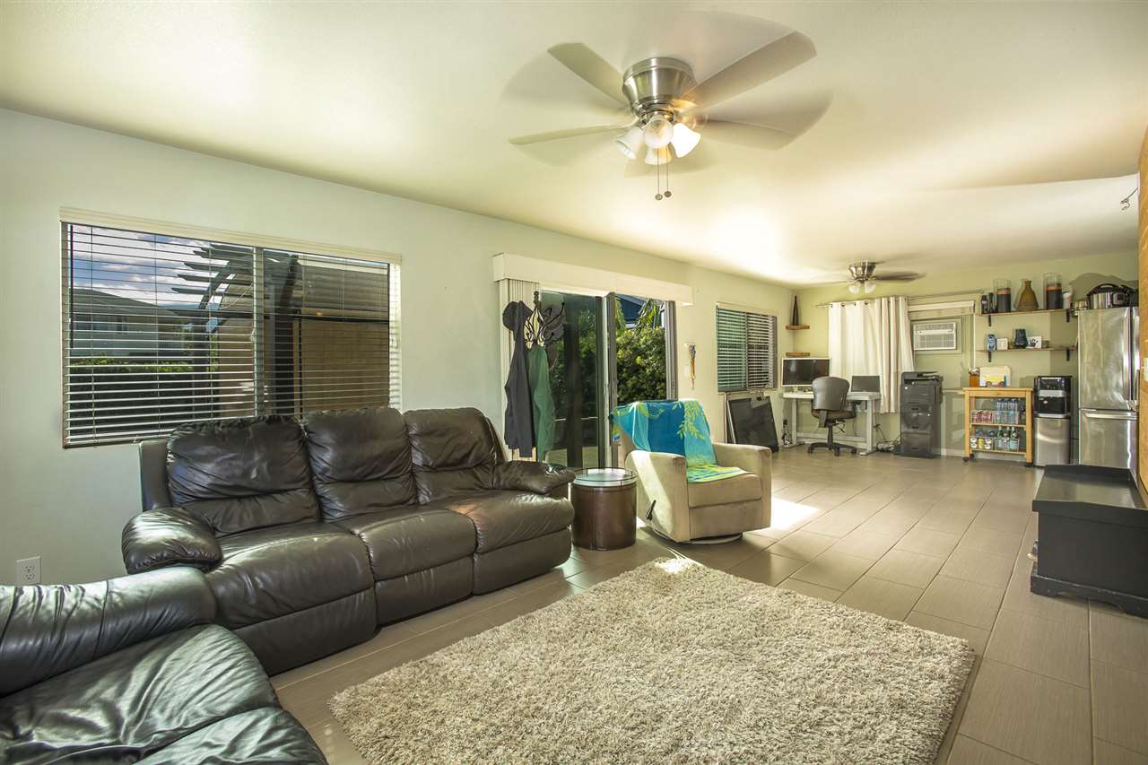 98 East Welakahao Road Kihei, HI 96753 - Photo 5 of 26 a living room with furniture and a large window