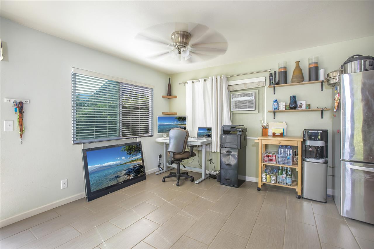 98 East Welakahao Road Kihei, HI 96753 - Photo 7 of 26 a view of a livingroom with furniture and a fireplace
