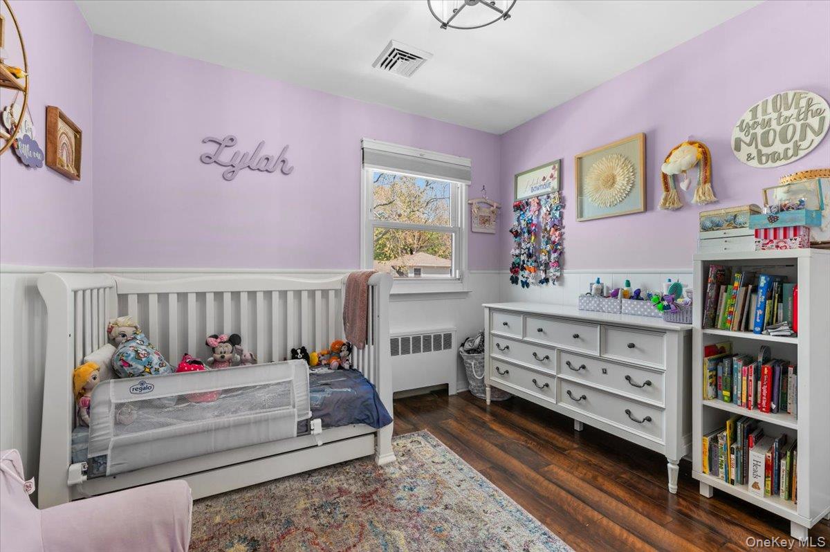 61 Winthrop Road Plainview, NY 11803 - Photo 19 of 37 a bed room with furniture and a window