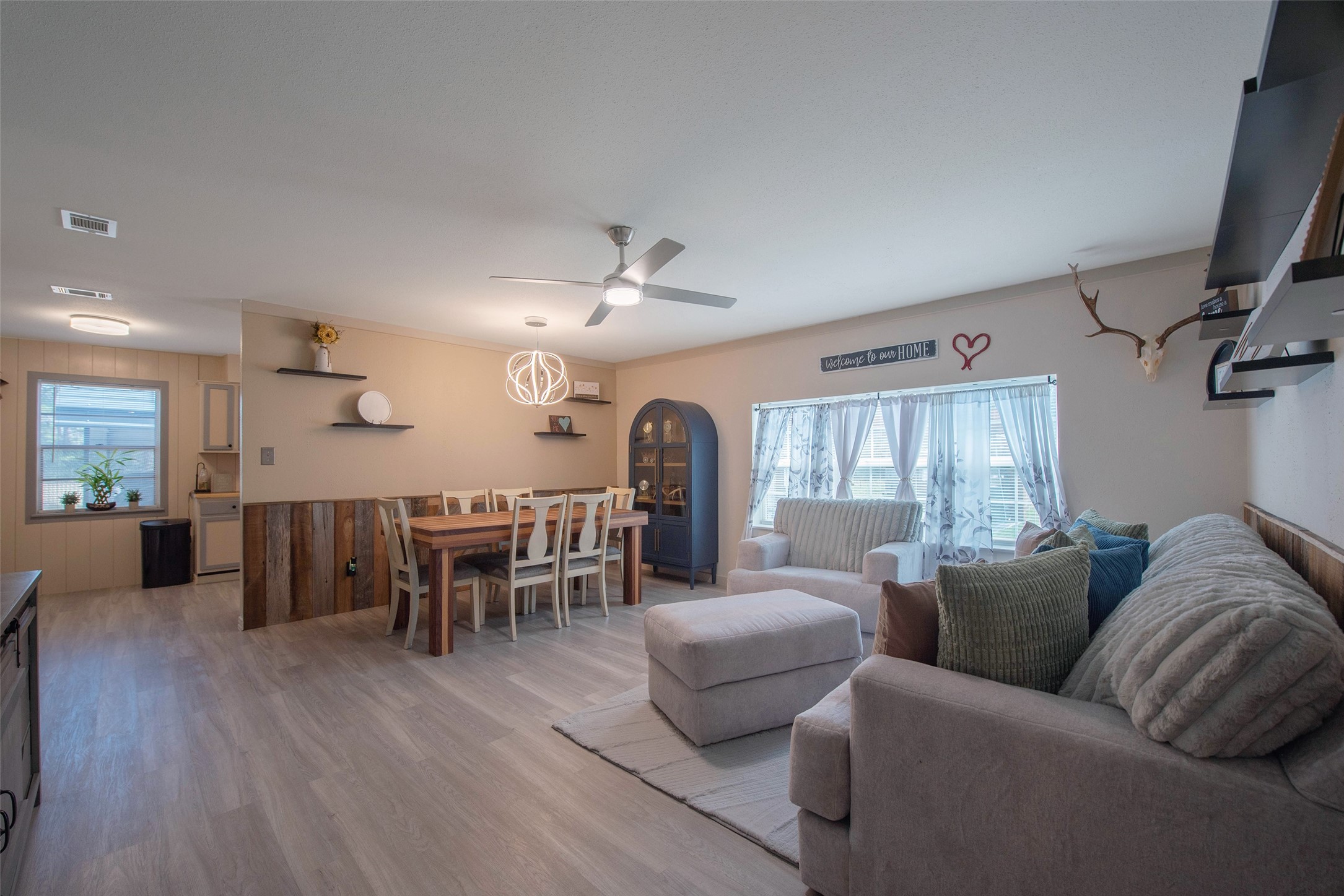 12998 Rocky Road Conroe, TX 77306 - Photo 15 of 50 a living room with furniture and a wooden floor