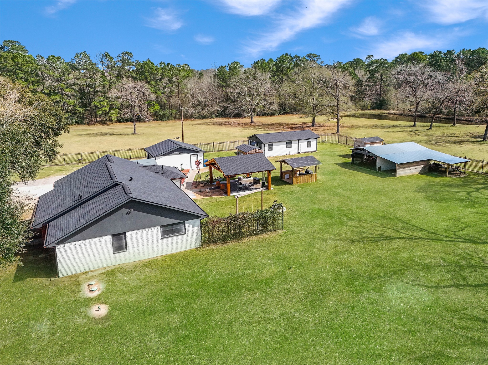 12998 Rocky Road Conroe, TX 77306 - Photo 2 of 50 a view of a lake with couches and city view